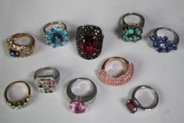 A collection of ten silver gem-set rings of various designs. Set with turquoise, sapphire, garnet,