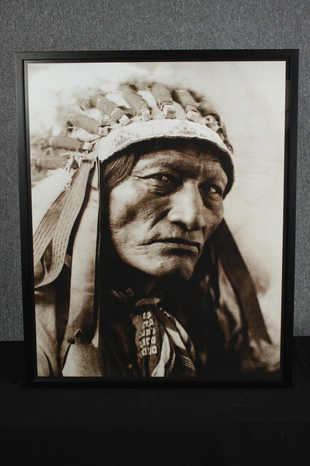 A large photographic portrait of a Native American. Framed. H.90 W.73 cm. - Image 2 of 3