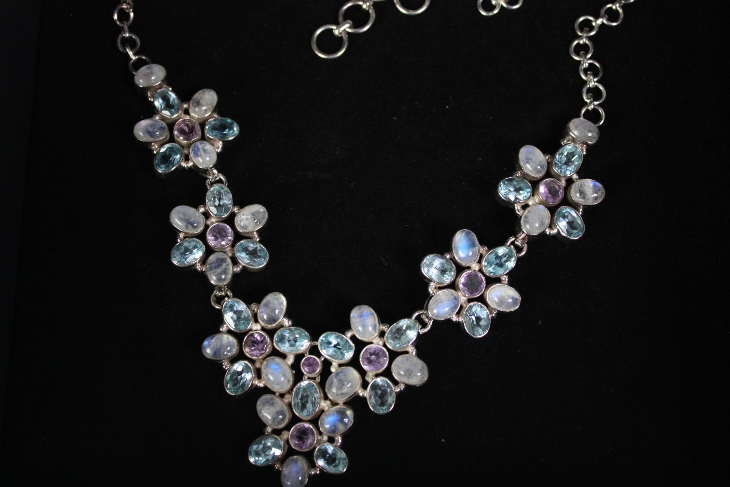 Two boxed statement articulated silver and gemstone necklaces. One of a floral design set with - Image 2 of 6