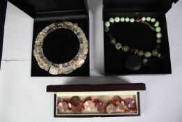 Three boxed statement necklaces, an abalone shell panel collar necklace, a jasper bead and red glass