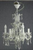 A French chandelier with five branches of lights and draped in pear and tear drop crystal glass. H.