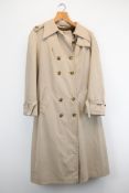 Vintage women’s trench coats with a brown mink fur lining. No makers mark or size but probably a