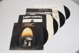 Four 12' LPs to include Larry Coryell.