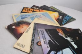 A mixed collection of nine 12' LPs.