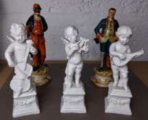 Three porcelain cherubs and two other figures.