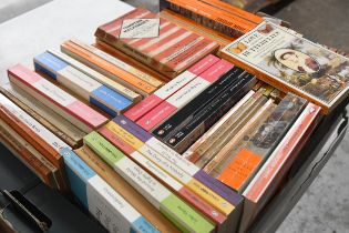 A collection of modern and vintage Penguin paperback books.