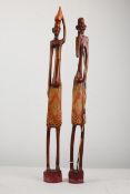 Two tribal carved figures. Hunters. 64cm high