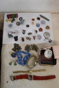 A collection of badges, medals, watches and a jewellery. Including enamelled and regimental