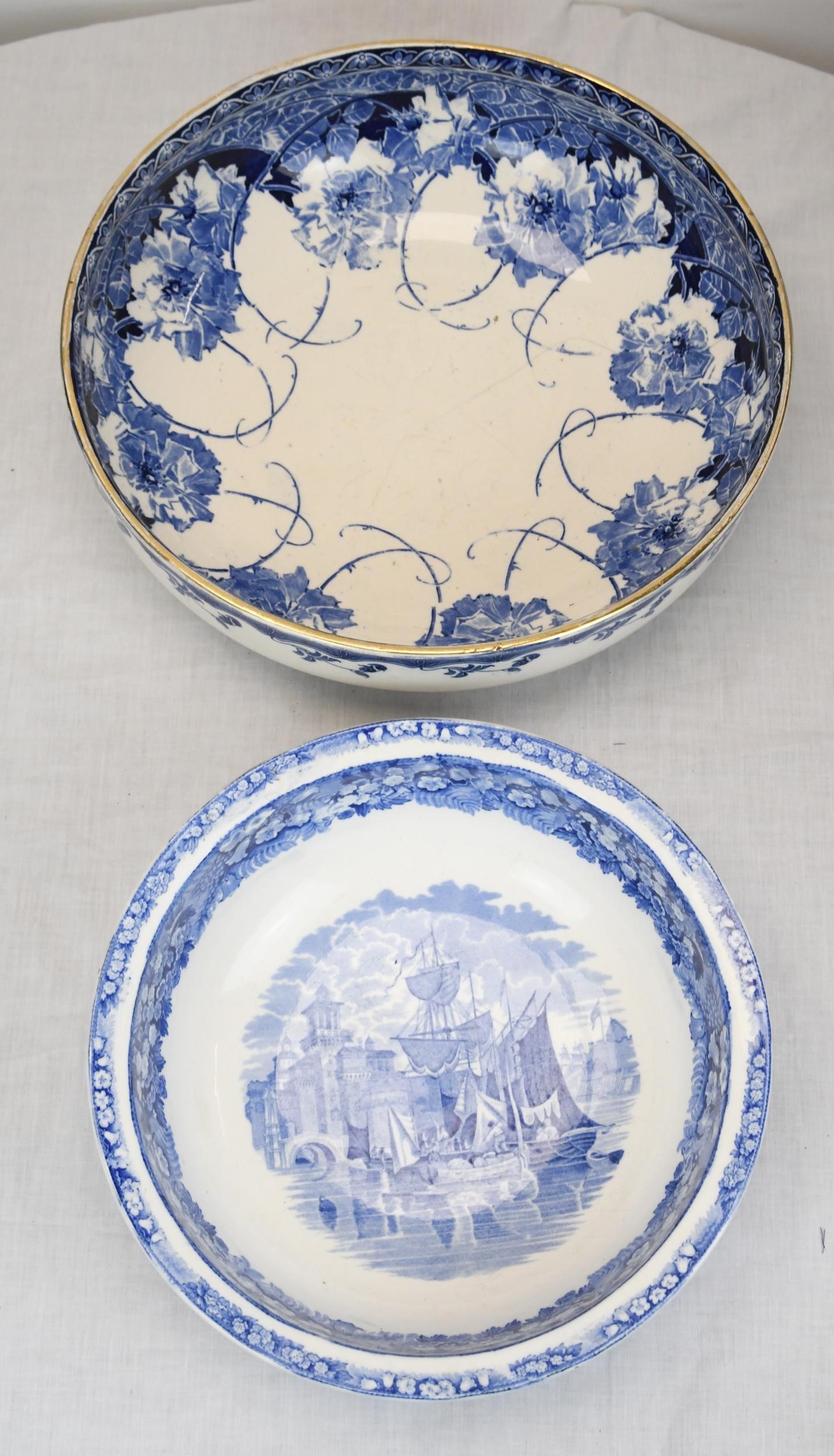 Two Royal Doulton hand painted blue and white early twentieth century ceramics. The largest has a