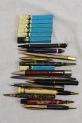 A good collection of mechanical propelling pencils including some silver examples together with some