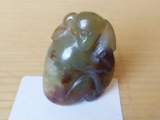 A Chinese carved jade mother monkey and her baby.