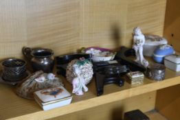 A assortment of collectables to include plate stands, trinket boxes and figurines.