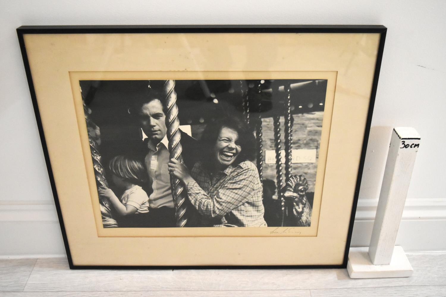 Indistinctly signed; Family at the Fair, a mounted black and white photograph, framed. H.46 W.54cm - Image 3 of 3