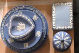 A small collection of Wedgwood Jasper Ware china plates and trinket boxes.