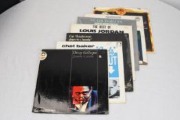 A mixed collection of seven 12' LPs including 'The Best of Louis Jordan'.