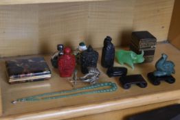 A mixed collection of oriental items including Chinese snuff bottles, a green agate necklace and