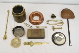 A collection of brass and copper, including a brass horse head shoe horn, a gavel, a copper