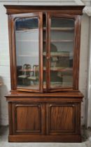 A 19th century style mahogany library bookcase, in two sections. H.223 W.130 D.60cm.