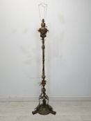 A Victorian brass standard oil lamp converted to electricity. H.186cm.