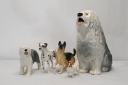 A collection of Beswick ceramic dogs.