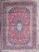 Carpet, hand knotted Persian with triple medallions within scrolling foliate spandrels and