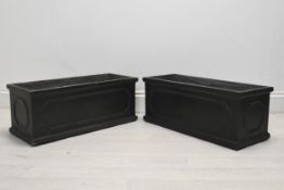 A pair of 19th century style faux lead planters, modern in fibreclay. H.26 W.58 D.23cm.