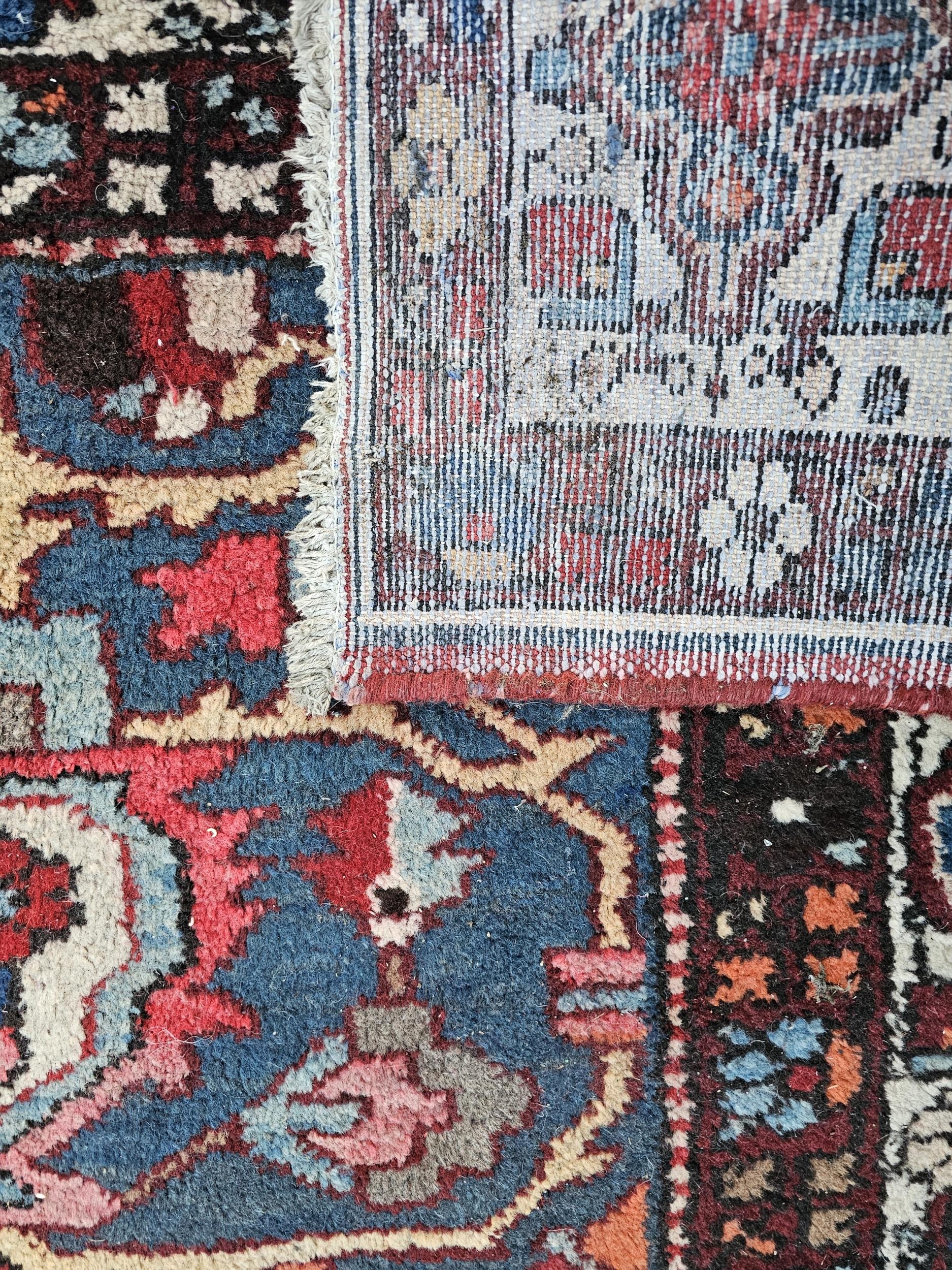 Carpet, hand knotted Persian with central sapphire flowerhead medallion on a madder ground within - Image 2 of 3