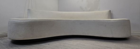 Sofa, contemporary of curved shape in fabric upholstery. H.85 W.290 D.103cm.