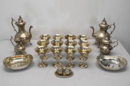 A collection of silver plated items, including an engraved silver plate three piece coffee set, a