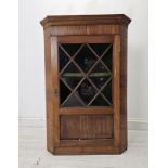 Hanging corner cabinet, 19th century mahogany astragal glazed with two panels missing. H.100 W.70