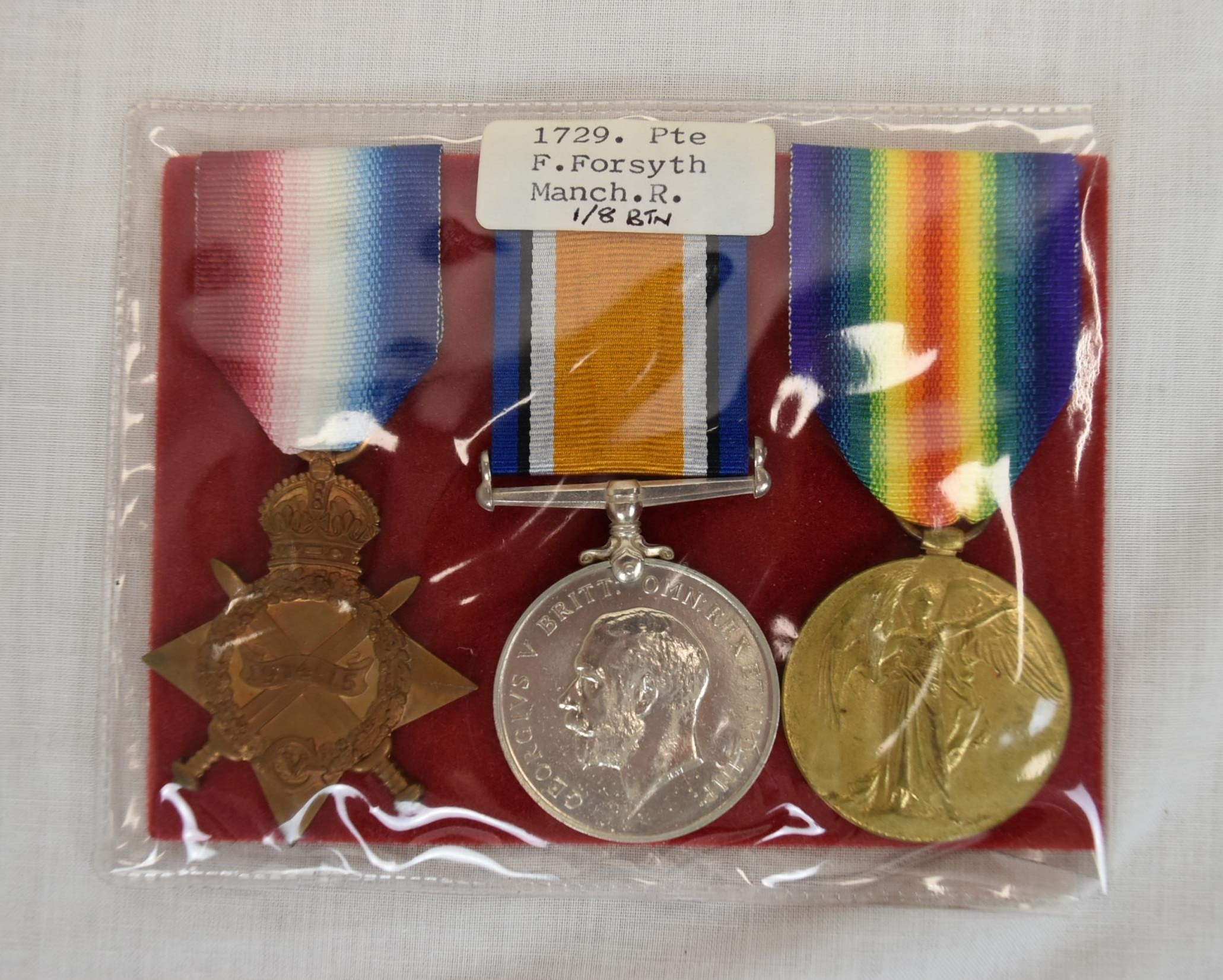 Pte Frank Forsyth of the Manchester Regiment. Medals with description card of soldier.