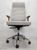 A Porada office desk chair. H.130 W.60 D.62cm. (Worn in places as shown).