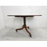 Breakfast table, early 19th century mahogany with tilt top action. H.72 W.107 D.67cm.