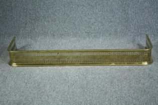 A 19th century brass fire fender. H.15 W.125 cm.