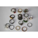 A collection of fifteen silver and silver and gem-set rings of various designs. Set with pearls,