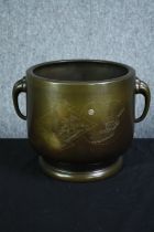A large Chinese bronze twin handled urn with an etched decoration of pagoda in moonlight. H.23