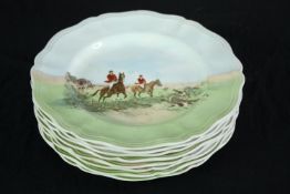Royal Doulton. A set of eight plates. Scallop edged and featuring hunting scenes. Circa 1930. Dia.