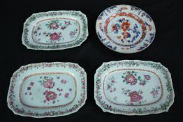 Four Chinese and Japanese serving plates with floral decorations.