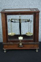 Vintage Baird & Tatlock (London). Chemical Balance Scales. In a wooden glazed case. H.45 W.40 D.22