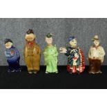 A collection of five vintage hand painted ceramic decanters modelled as various figures, including