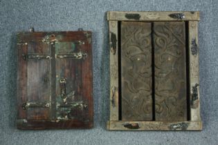 An Eastern teak window pane mirror with shutters and a similar missing it's glass. H.74 W.57cm. (