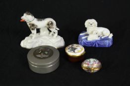 A mixed collection of Staffordshire dogs and enamelled trinket boxes. An Asprey Limoges hand painted