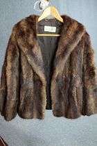 A vintage brown mink fur coat with brown silk lining by Scottish furriers Alexander Wilkie. Label to