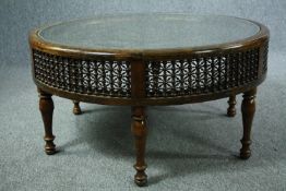 Coffee table, brass and carved hardwood of North African influence. H.49. Dia.98cm.