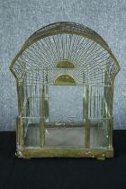 A vintage metal birdcage with a glazed door. H.42 W.33 D.24 cm.