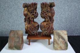 A pair of marble bookends and a pair of carved Chinese dragons. The dragons have been lacquered