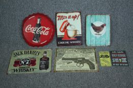 A collection of six metal signs. Reproductions. Including Coca-Cola, Pepsi and Smith & Wesson. H.