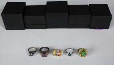 Five boxed silver and gemstone dress rings, set with jade, peridot, garnet and coloured sapphires.