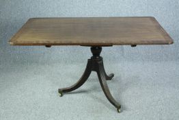 Breakfast or dining table, Regency mahogany and crossbanded with tilt top action. H.71 L.137 W.89cm.