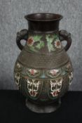 A large early 20t century Japanese Archaistic bronze Champlevé vase with twin elephant head handles.